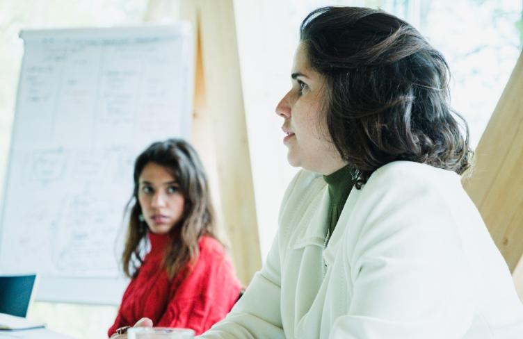 Two women at an APT workshop