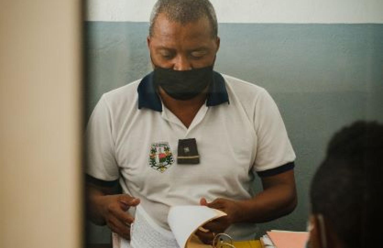 Officer reviewing registers